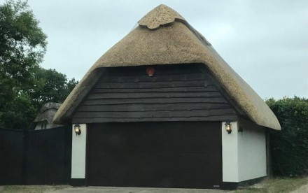 Finished re-thatch of a garage in the New Forest